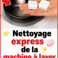 Vue de près d'une machine à laver lors d'un nettoyage avec des produits ménagers.